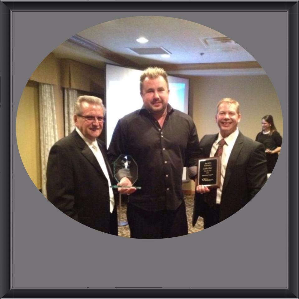 Dustin Luke Kay, professionally known as Luke Kay, receiving Top Recruiter of the Year recognition in 2012
